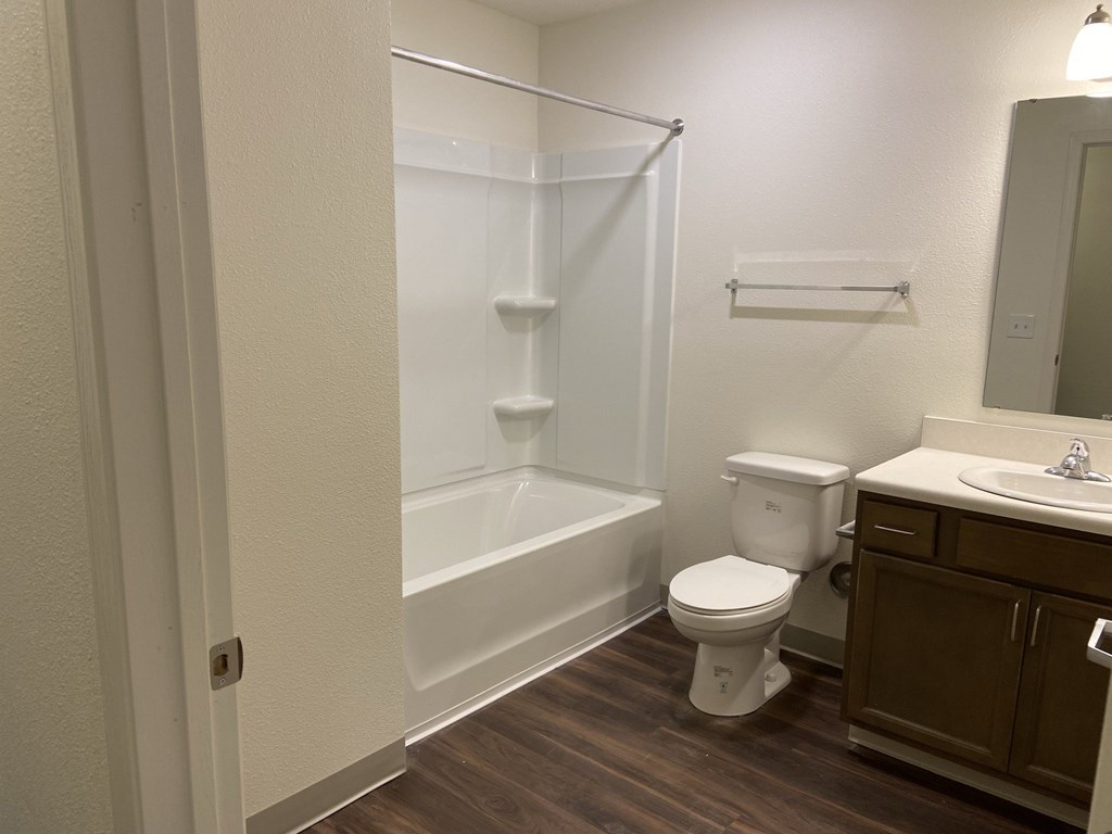 a bathroom with a shower toilet and sink